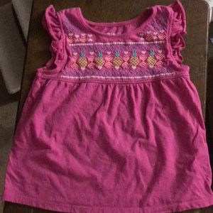 Top, barley worn, sleeveless,ruffle around arms .